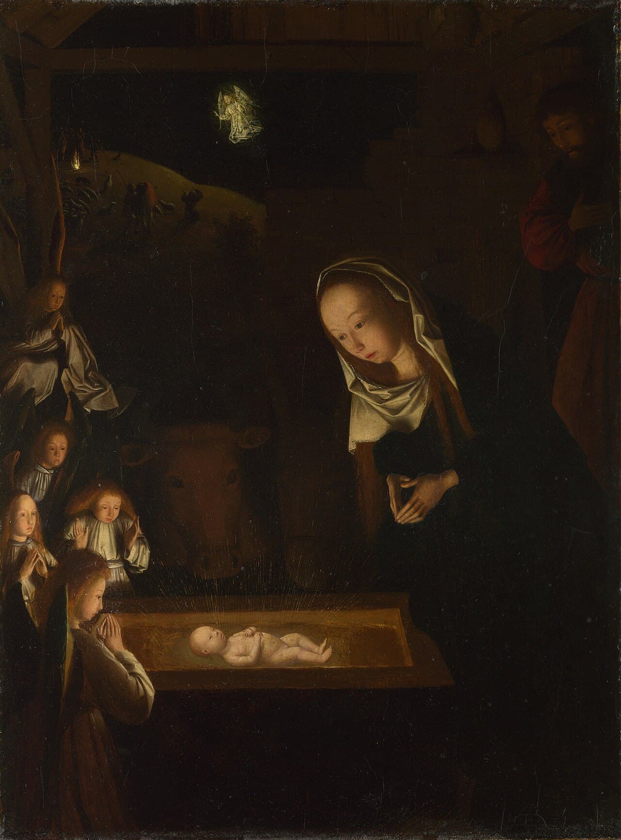 The Nativity at Night, a painting of about 1490, with the child in a manger lit against a dark stable.