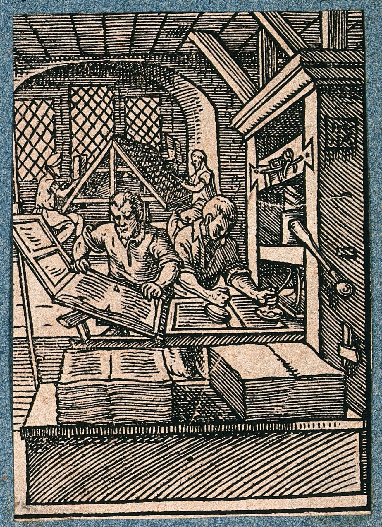 Woodcut of printers working a wooden press and setting type, by Jost Amman, 1568.